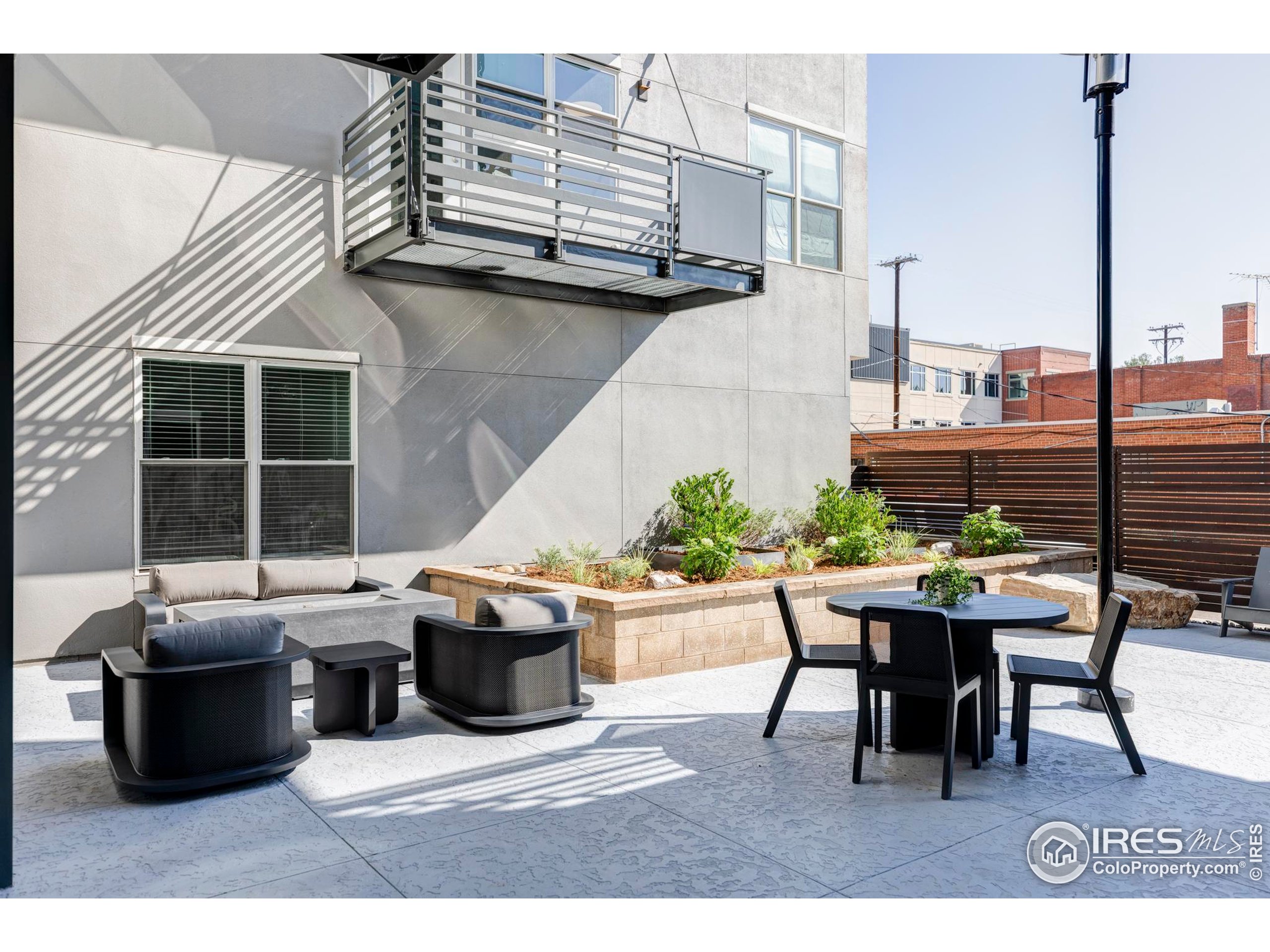 1707 Walnut Street, Unit 209 Boulder, CO 80302 - Photo 14 of 19 a backyard of a house with outdoor seating