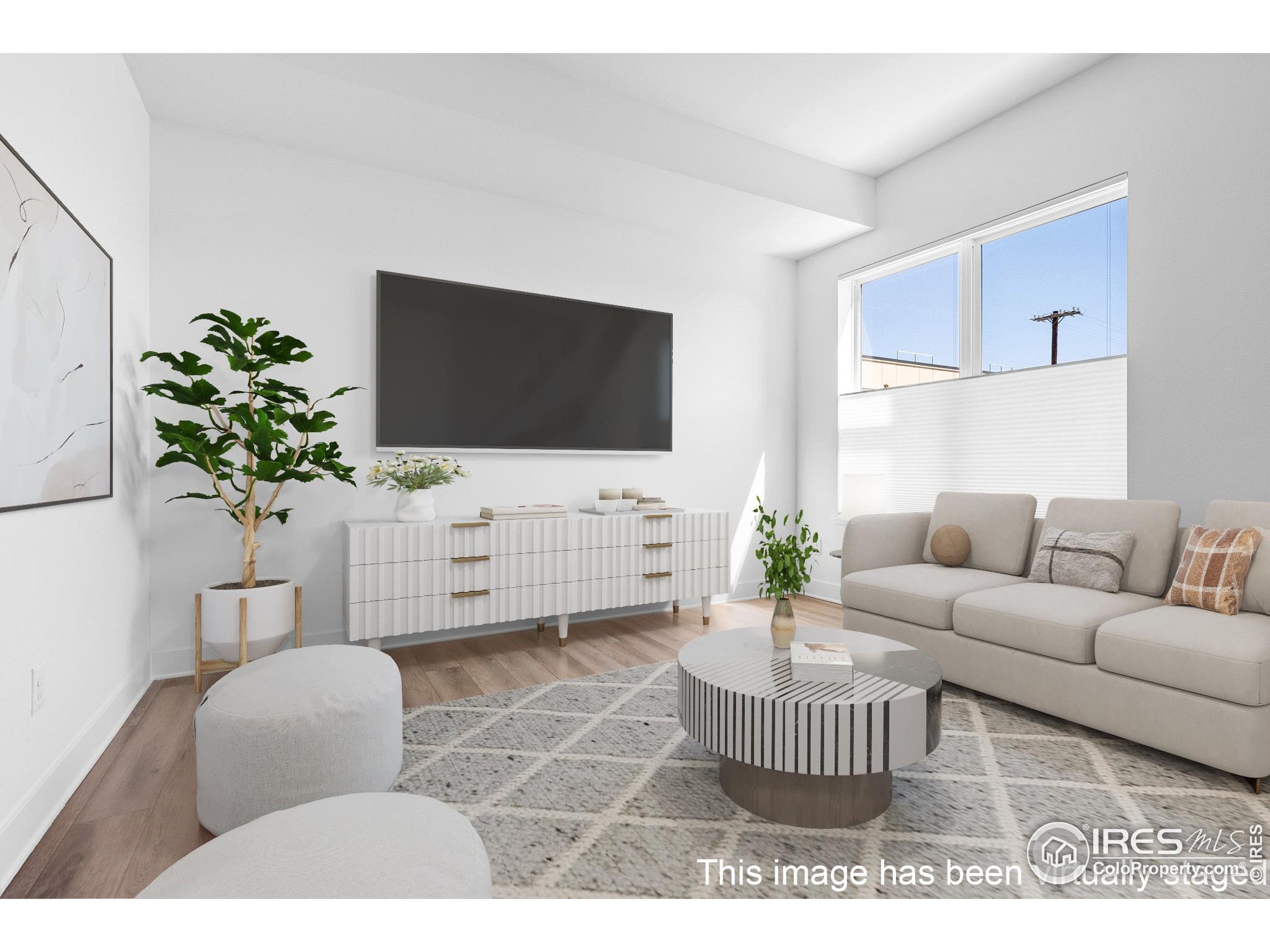 1707 Walnut Street, Unit 209 Boulder, CO 80302 - Photo 4 of 19 a living room with furniture and a flat screen tv