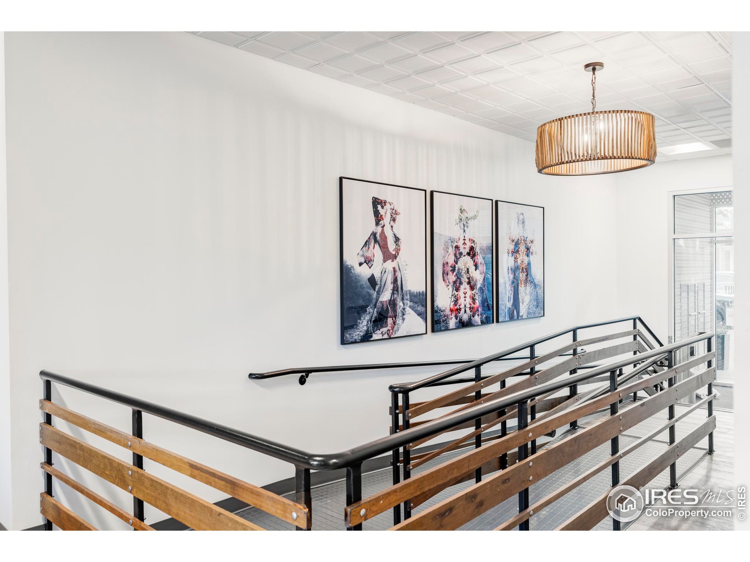 1707 Walnut Street, Unit 209 Boulder, CO 80302 - Photo 6 of 19 a view of a room with paintings on the wall