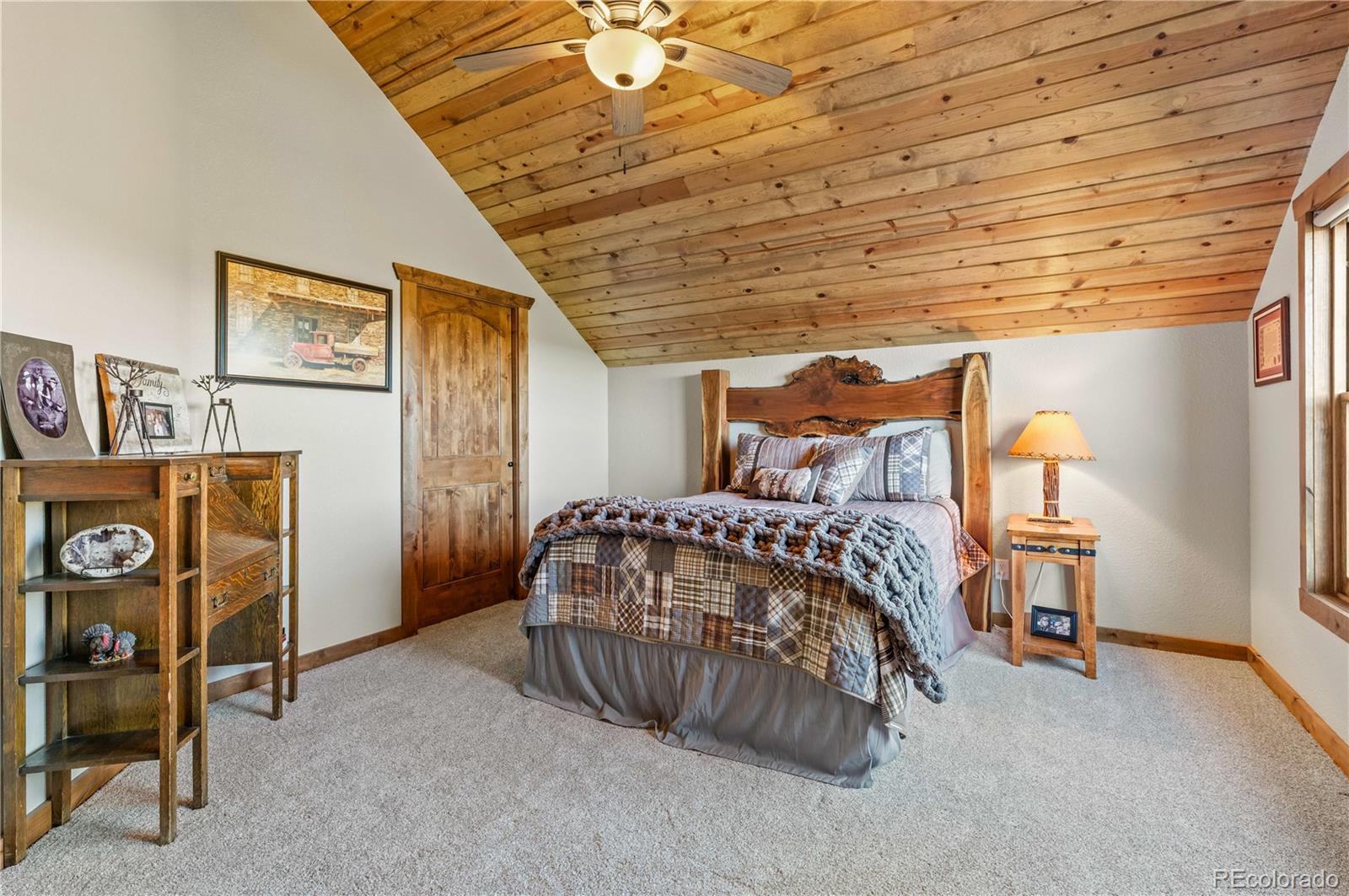 1310 Sunrise Ridge Cotopaxi, CO 81223 - Photo 41 of 50 a bedroom with a bed and a table in it