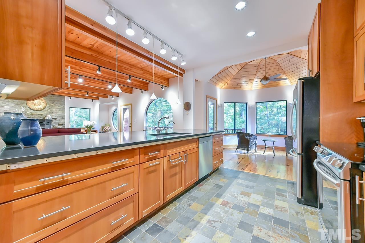 3616 Ragtime Road Hillsborough, NC 27278 - Photo 11 of 29 a large white kitchen with a large window