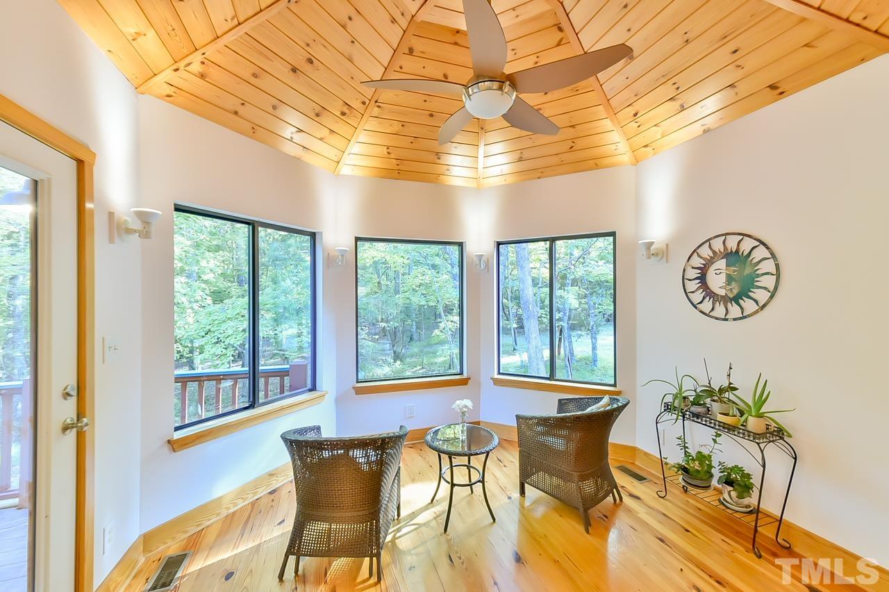 3616 Ragtime Road Hillsborough, NC 27278 - Photo 12 of 29 a view of a dining room with furniture a chandelier and a window