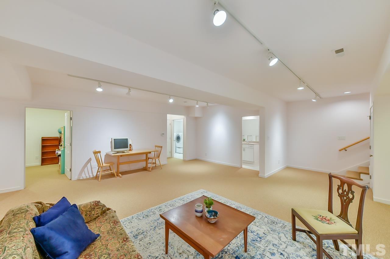 3616 Ragtime Road Hillsborough, NC 27278 - Photo 21 of 29 a living room with furniture and a couch