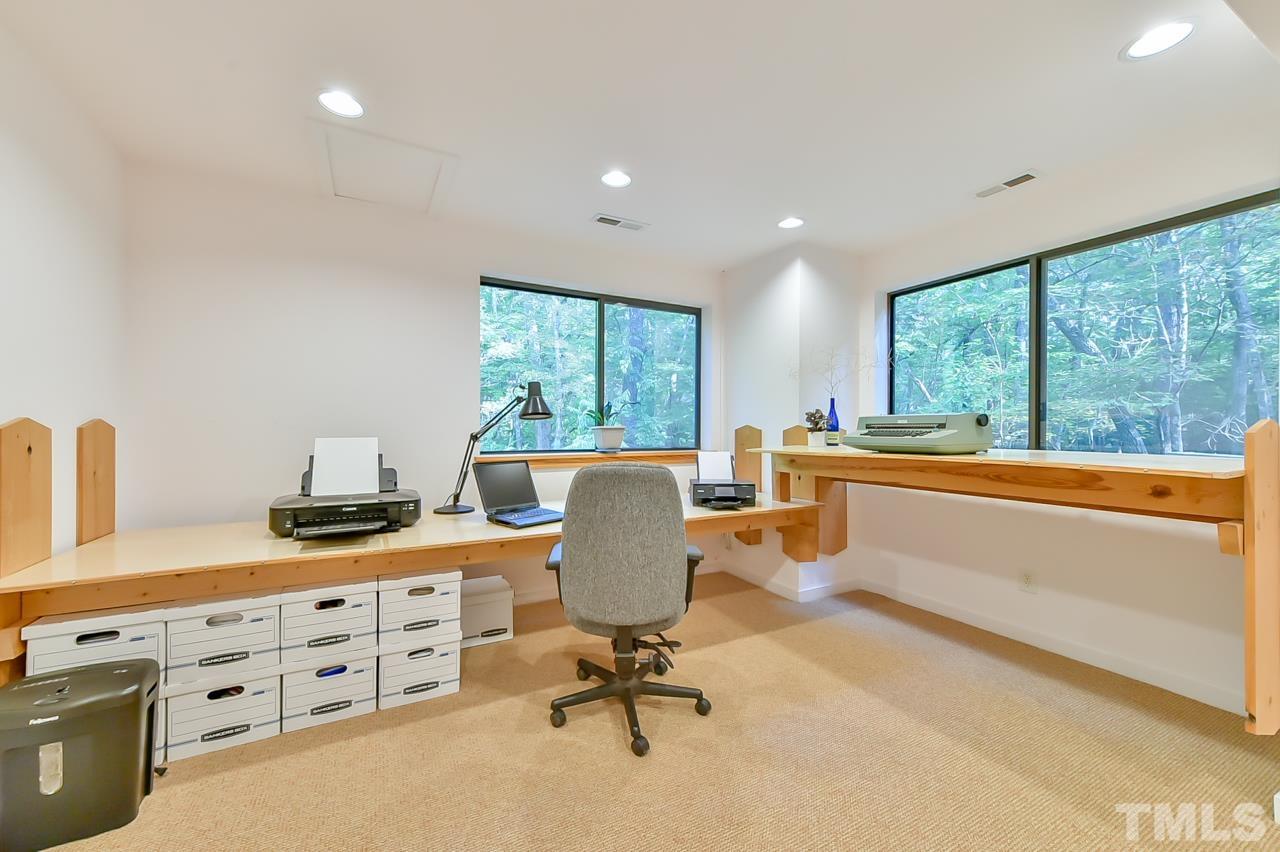 3616 Ragtime Road Hillsborough, NC 27278 - Photo 23 of 29 a view of a workspace with furniture and a window