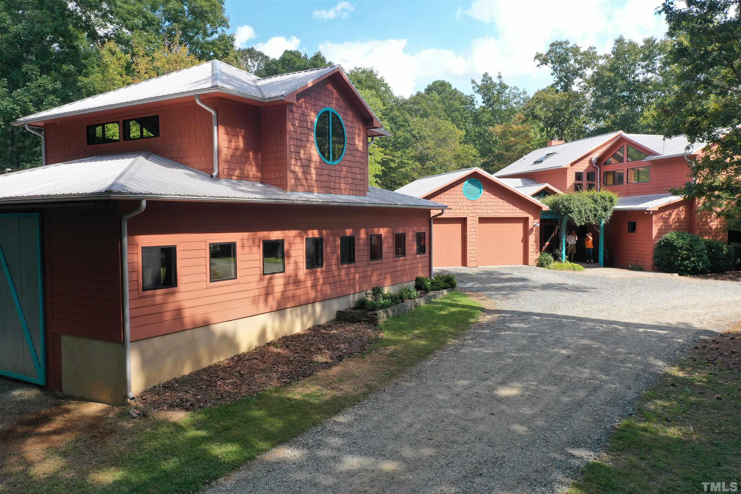 3616 Ragtime Road Hillsborough, NC 27278 - Photo 4 of 29 a front view of a house with a garden