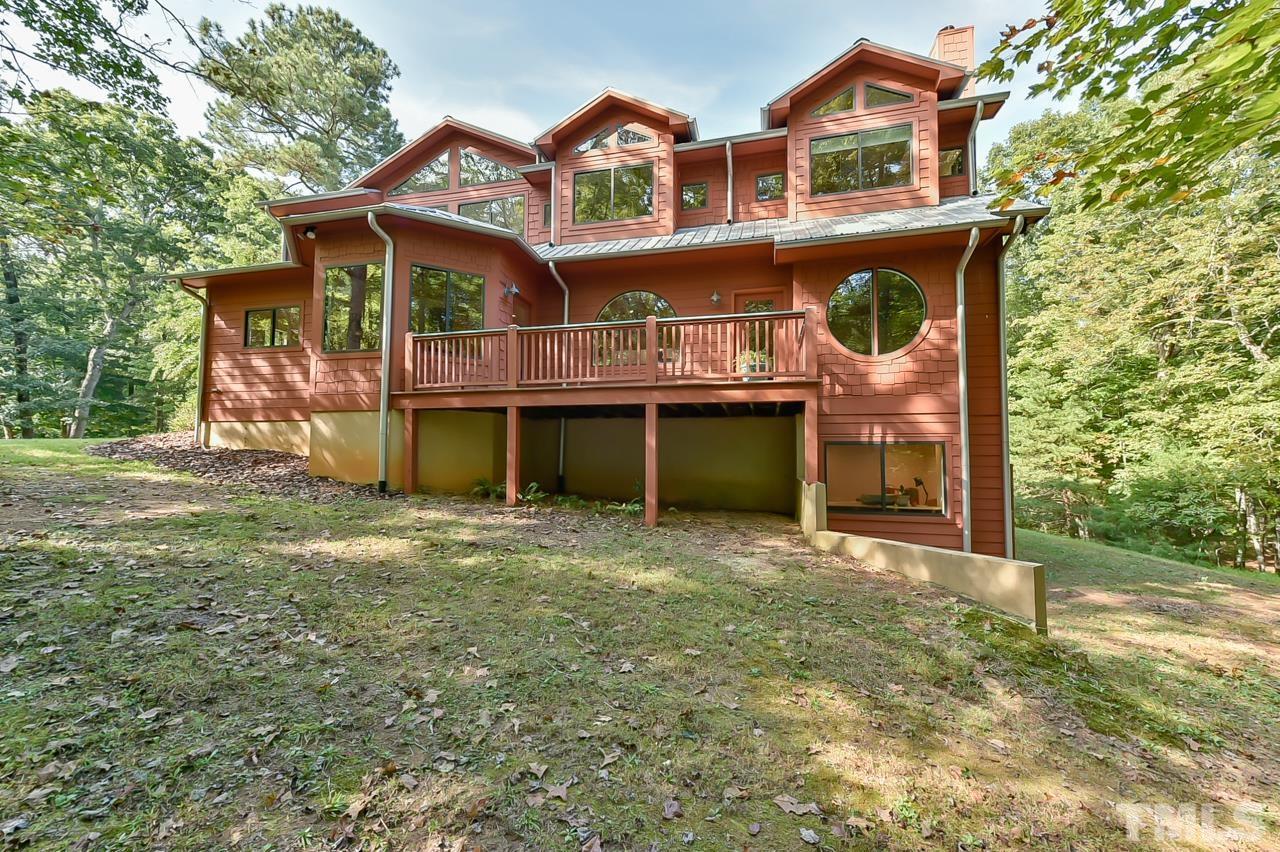 3616 Ragtime Road Hillsborough, NC 27278 - Photo 5 of 29 a view of a house with a yard and balcony