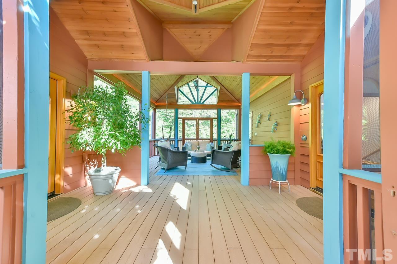 3616 Ragtime Road Hillsborough, NC 27278 - Photo 6 of 29 a view of a lobby with chair and wooden floor