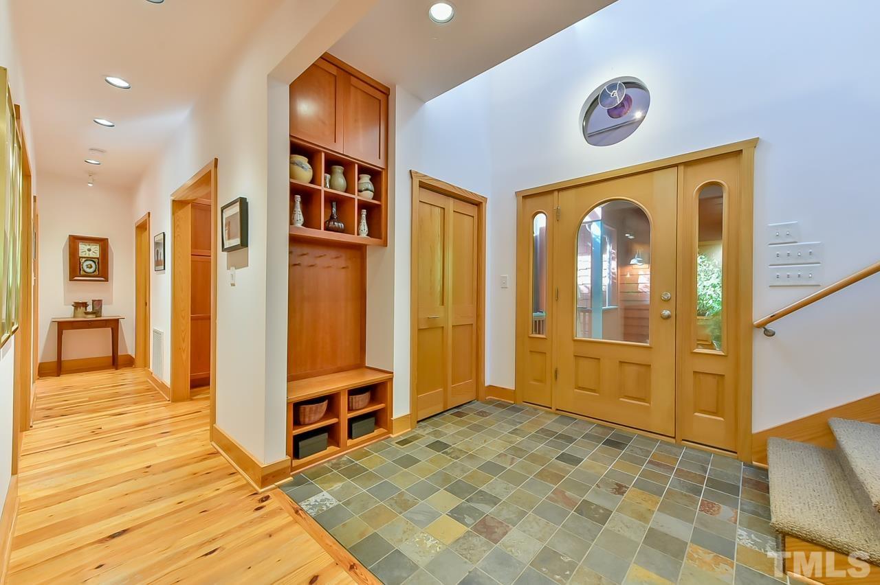 3616 Ragtime Road Hillsborough, NC 27278 - Photo 8 of 29 a view of a hallway with wooden floor and entryway