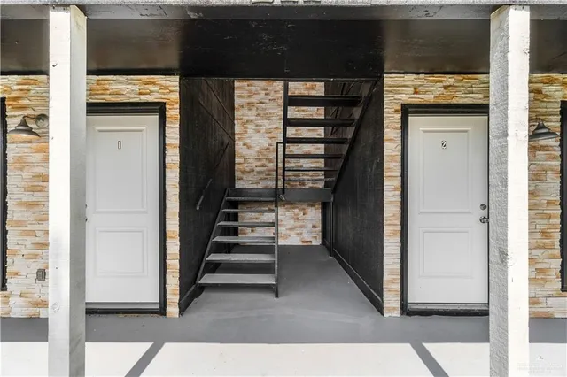 a large kitchen with stainless steel appliances granite countertop a stove a sink and a refrigerator