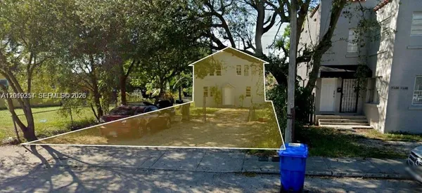 a view of a house with large trees