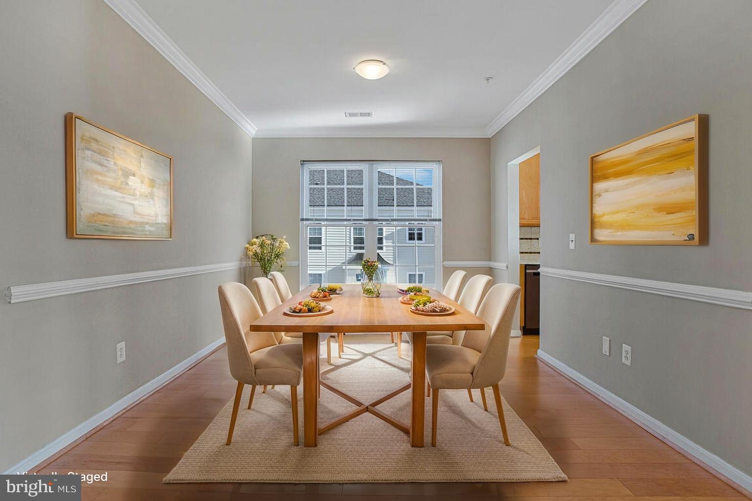 7325 Brookview Road, Unit 403 Elkridge, MD 21075 - Photo 10 of 65 a view of a dining room with furniture and wooden floor