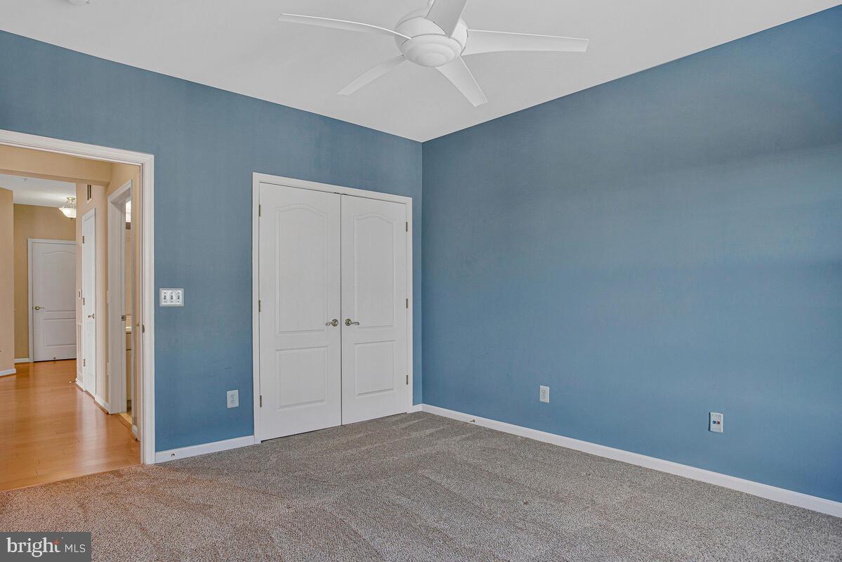 7325 Brookview Road, Unit 403 Elkridge, MD 21075 - Photo 29 of 65 a view of an empty room and wooden floor