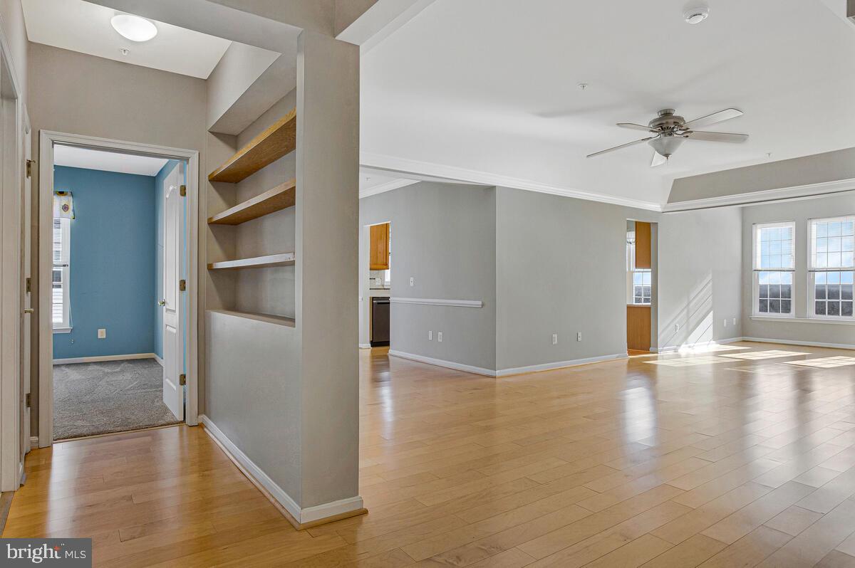 7325 Brookview Road, Unit 403 Elkridge, MD 21075 - Photo 4 of 65 a view of a livingroom with wooden floor and a ceiling fan