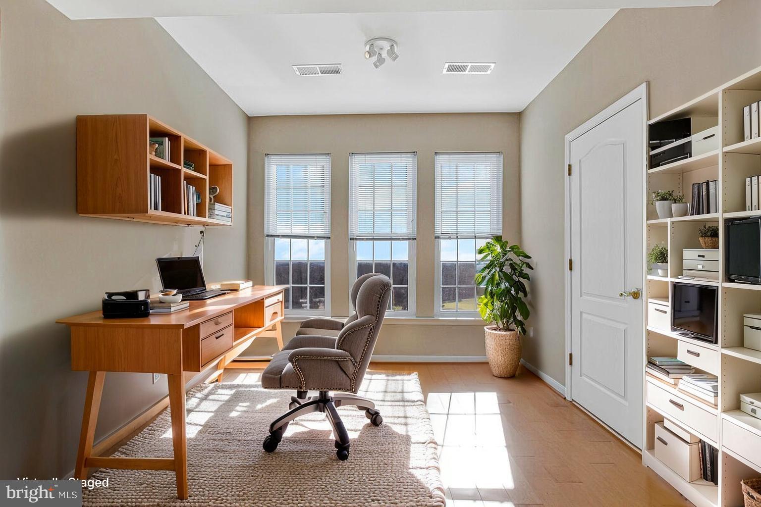 7325 Brookview Road, Unit 403 Elkridge, MD 21075 - Photo 8 of 65 a workspace with furniture and book shelf