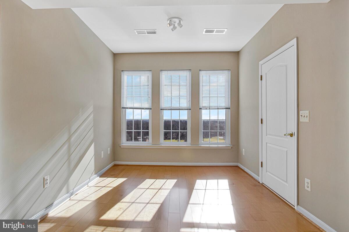7325 Brookview Road, Unit 403 Elkridge, MD 21075 - Photo 9 of 65 a view of an empty room with a window