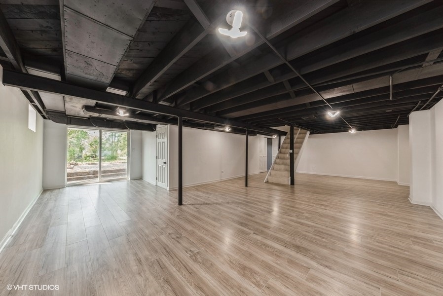403 Highview Drive Fox River Grove, IL 60021 - Photo 10 of 18 a view of an empty room with wooden floor