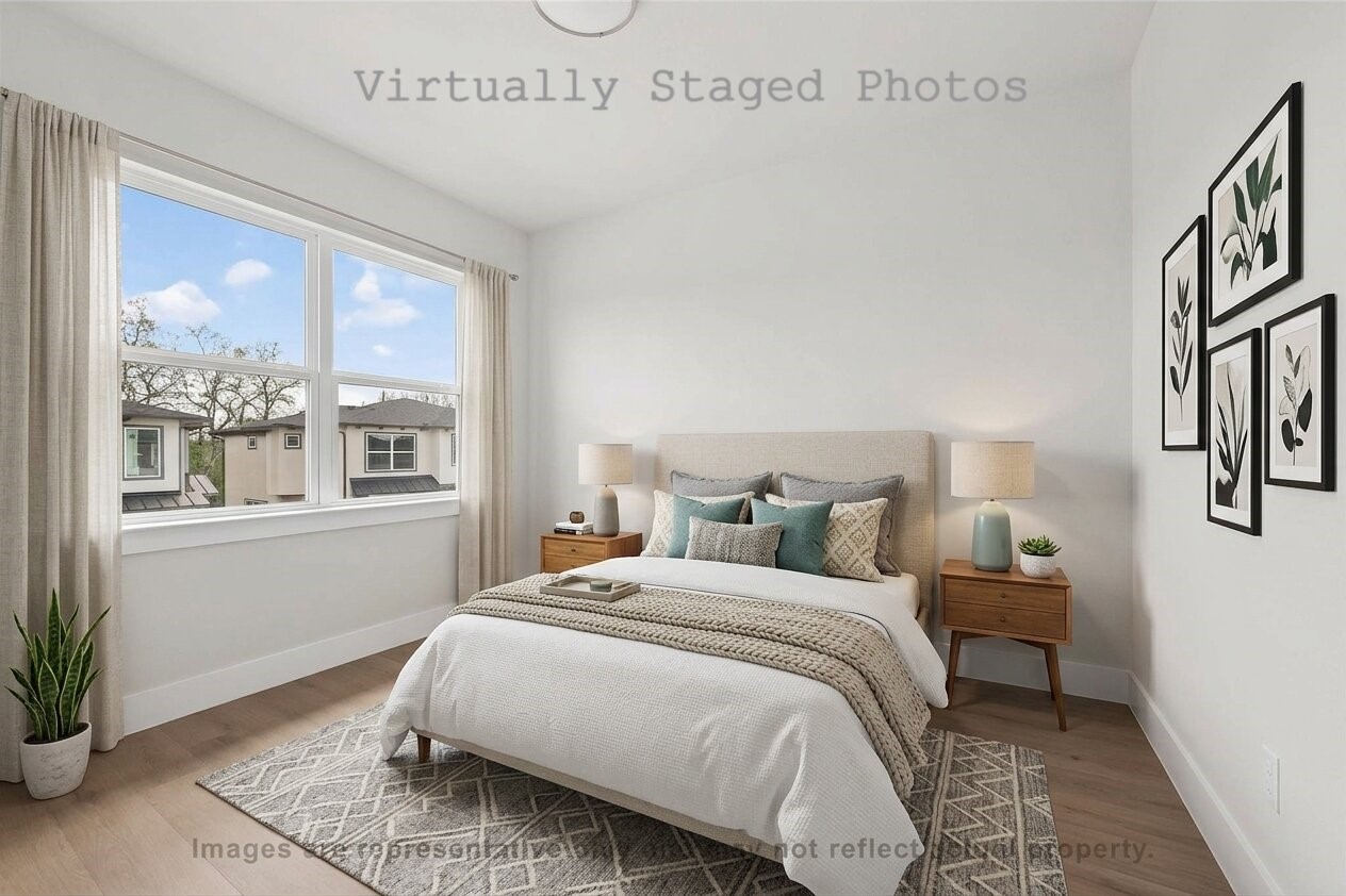 10719 Mason Road, Unit 26 Richmond, TX 77406 - Photo 6 of 50 Virtual Staging - Bedroom featuring light wood flooring, an upholstered bed with teal accents, mid-century modern nightstands, and a large window overlooking a landscaped yard