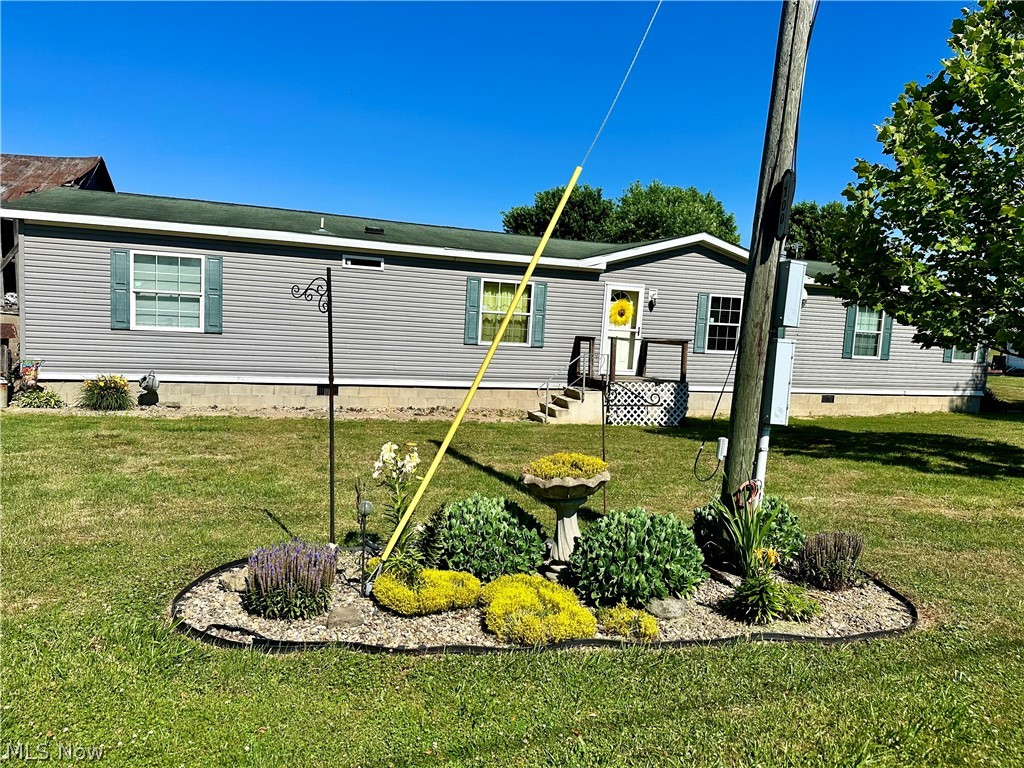 100 Anderson Road Fleming, OH 45729 - Photo 2 of 31 View of front flower bed