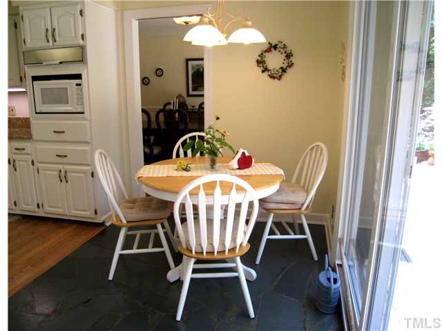2756 McDowell Road Durham, NC 27705 - Photo 10 of 25 Sunny & cheerful room with slate floors. Sliding doors open to Deck. Pocket door to the Dining Room. Breakfast Area