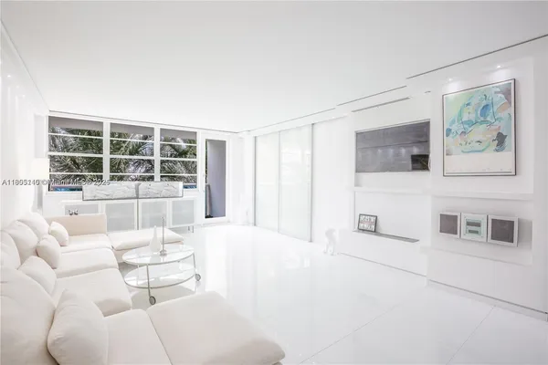 a living room with furniture and large window