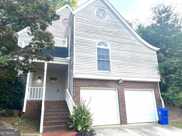 a view of house with large windows
