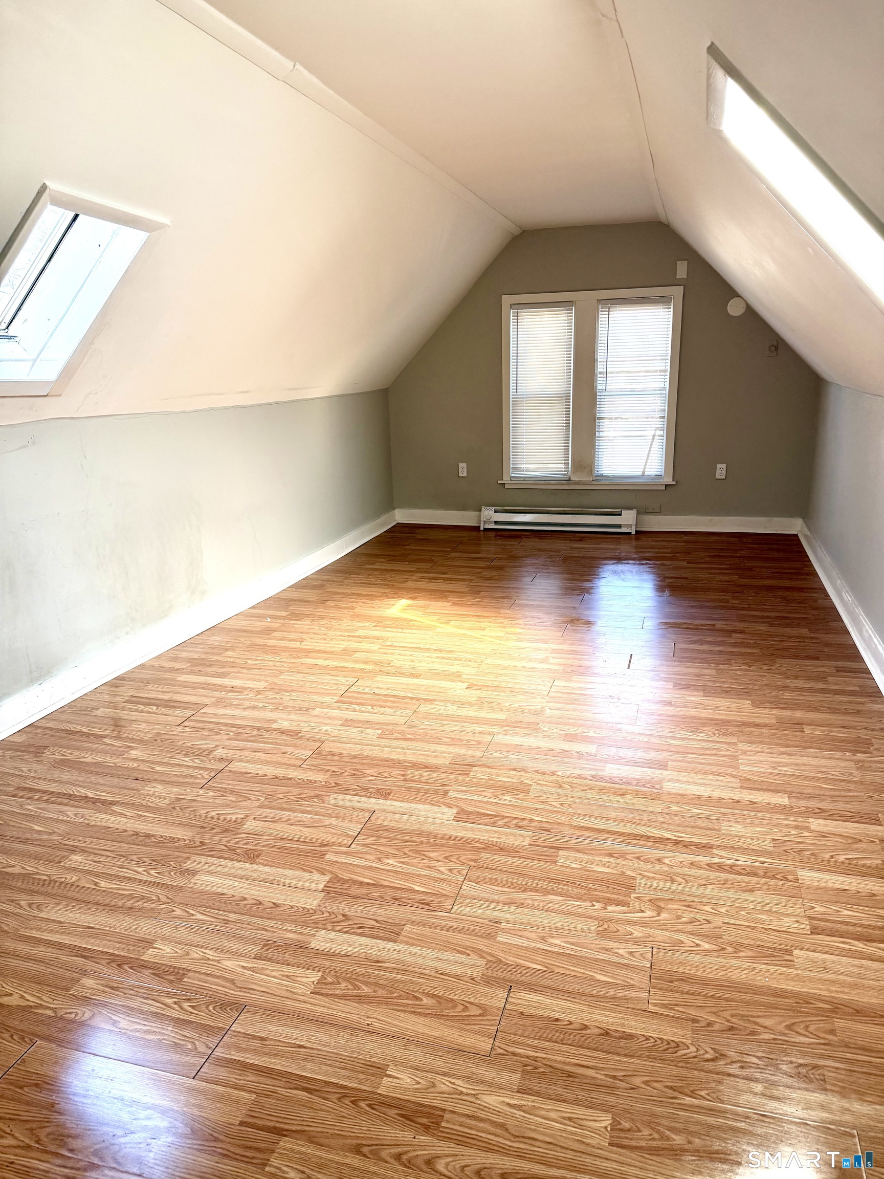 76 3rd Street New Haven, CT 06519 - Photo 11 of 20 an empty room with wooden floor and windows