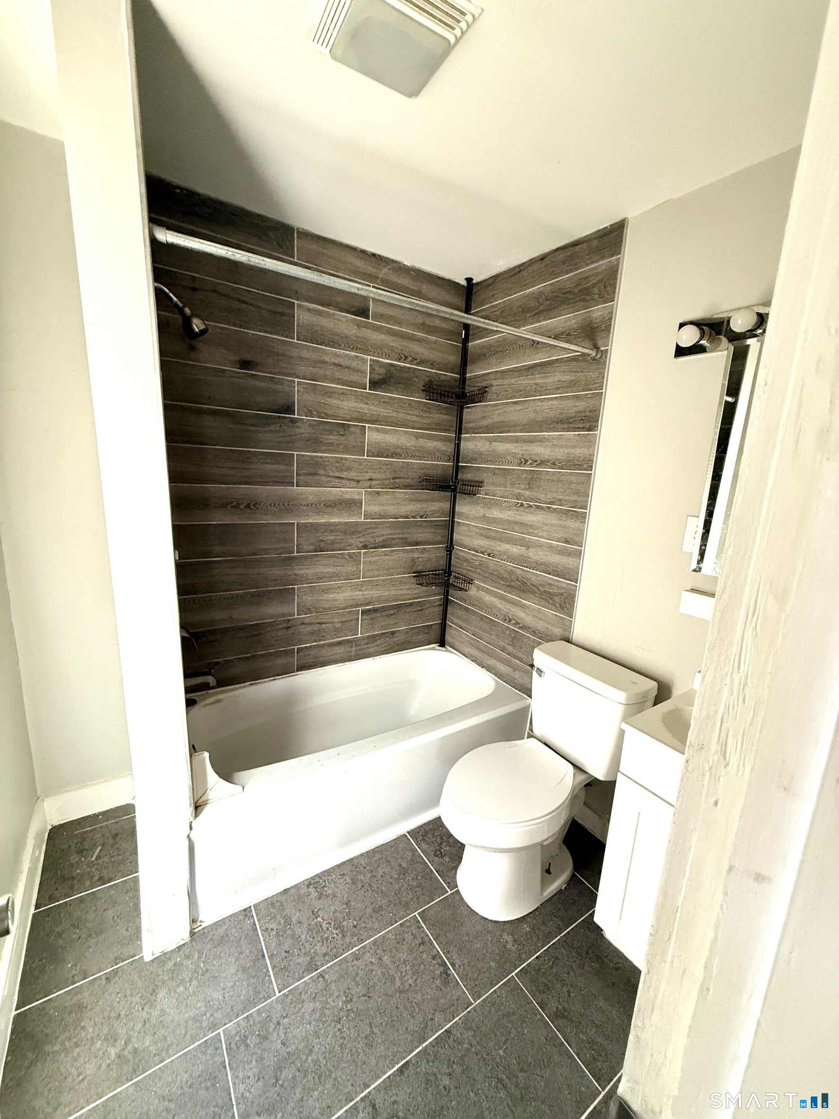 76 3rd Street New Haven, CT 06519 - Photo 8 of 20 a bathroom with a bathtub and a toilet