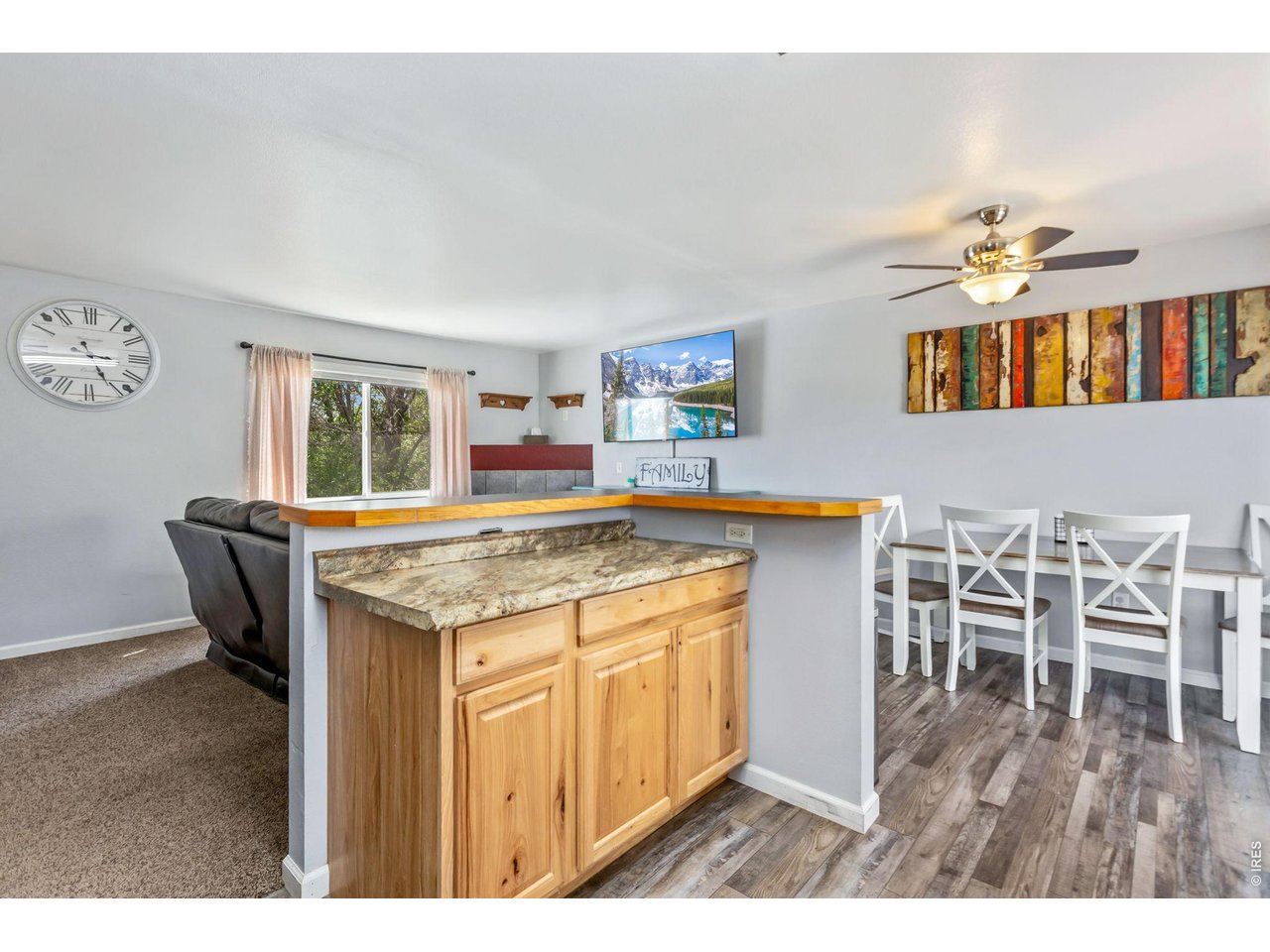 233 East 19th Street Road Greeley, CO 80631 - Photo 10 of 22 a kitchen with a stove and cabinets
