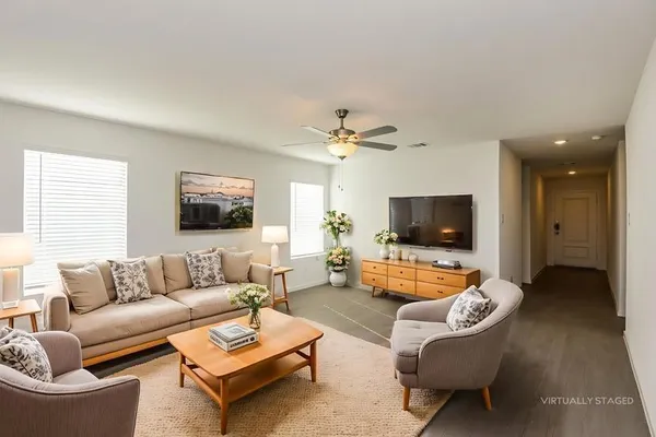 a living room with furniture and a flat screen tv