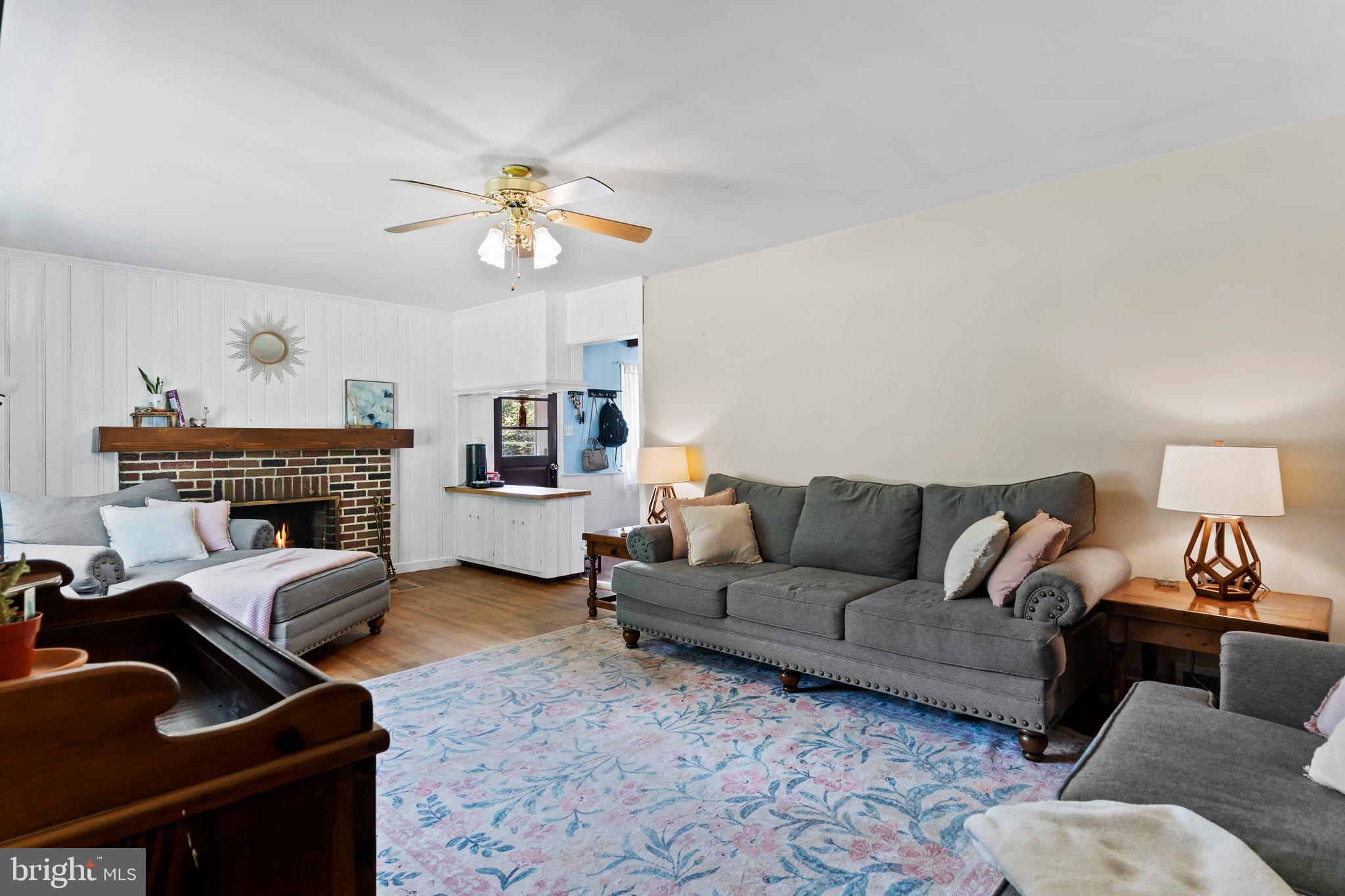 2740 Cape Horn Road Red Lion, PA 17356 - Photo 5 of 42 a living room with furniture a fireplace and a chandelier