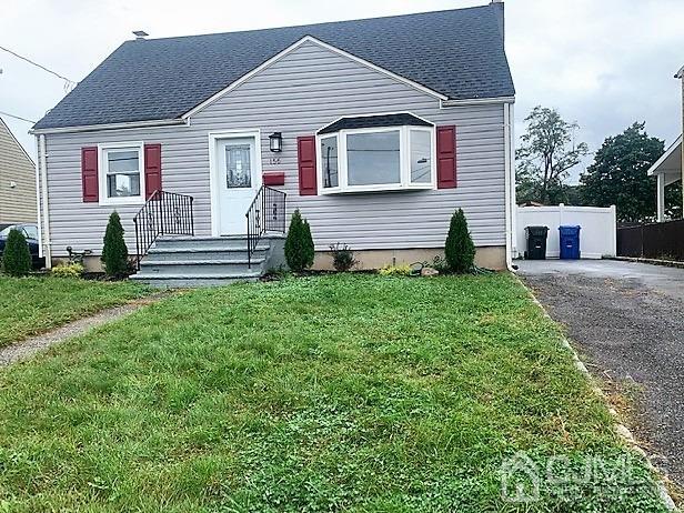156 East Hill Road Colonia, NJ 07067 - Photo 2 of 33 a front view of a house with a yard