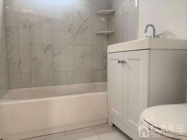 156 East Hill Road Colonia, NJ 07067 - Photo 15 of 33 a bathroom with a bathtub and a toilet