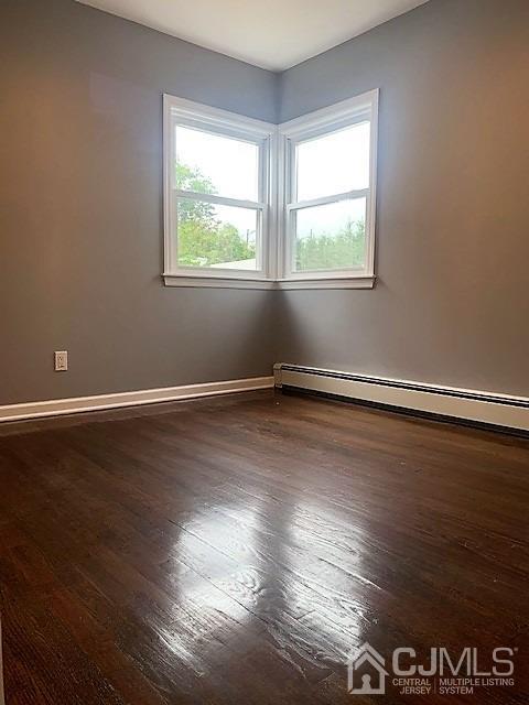 156 East Hill Road Colonia, NJ 07067 - Photo 19 of 33 a view of an empty room with wooden floor and a window