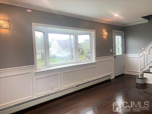 156 East Hill Road Colonia, NJ 07067 - Photo 3 of 33 an empty room with wooden floor and windows