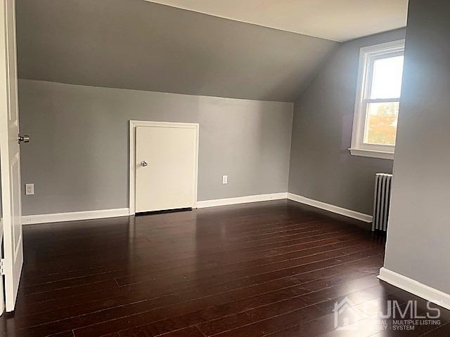 156 East Hill Road Colonia, NJ 07067 - Photo 22 of 33 an empty room with wooden floor and windows