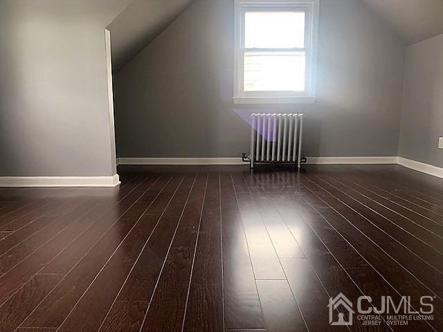 156 East Hill Road Colonia, NJ 07067 - Photo 23 of 33 an empty room with wooden floor and windows