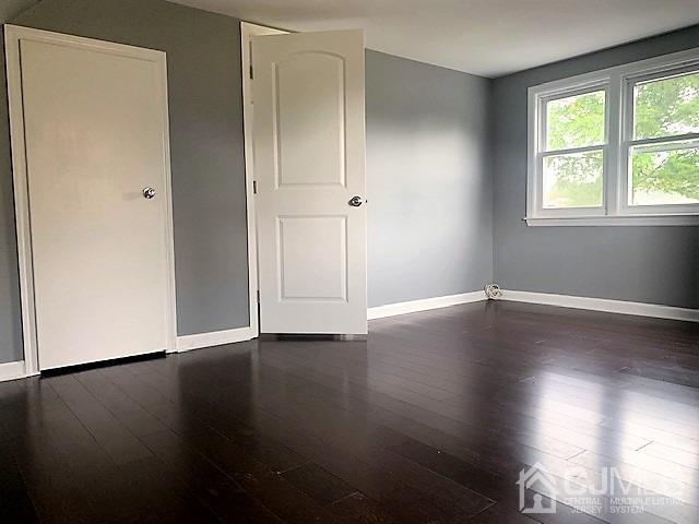 156 East Hill Road Colonia, NJ 07067 - Photo 24 of 33 a view of wooden floor and windows in a room