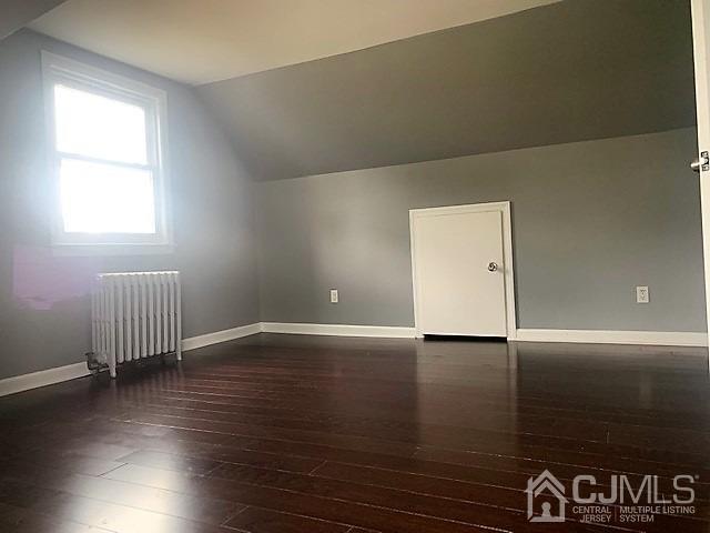 156 East Hill Road Colonia, NJ 07067 - Photo 25 of 33 an empty room with wooden floor and windows
