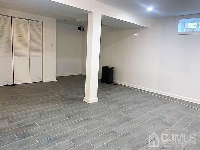 156 East Hill Road Colonia, NJ 07067 - Photo 28 of 33 an empty room with wooden floor and closet