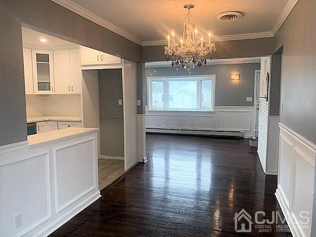 156 East Hill Road Colonia, NJ 07067 - Photo 8 of 33 a view of kitchen with kitchen island granite countertop a refrigerator and a stove top oven