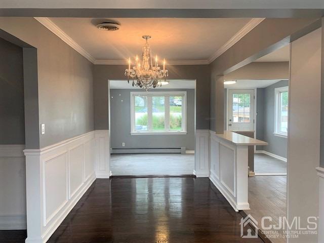 156 East Hill Road Colonia, NJ 07067 - Photo 9 of 33 a view of a hallway with wooden floor and chandelier