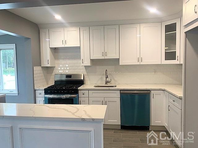 156 East Hill Road Colonia, NJ 07067 - Photo 10 of 33 a kitchen with cabinets appliances and a window