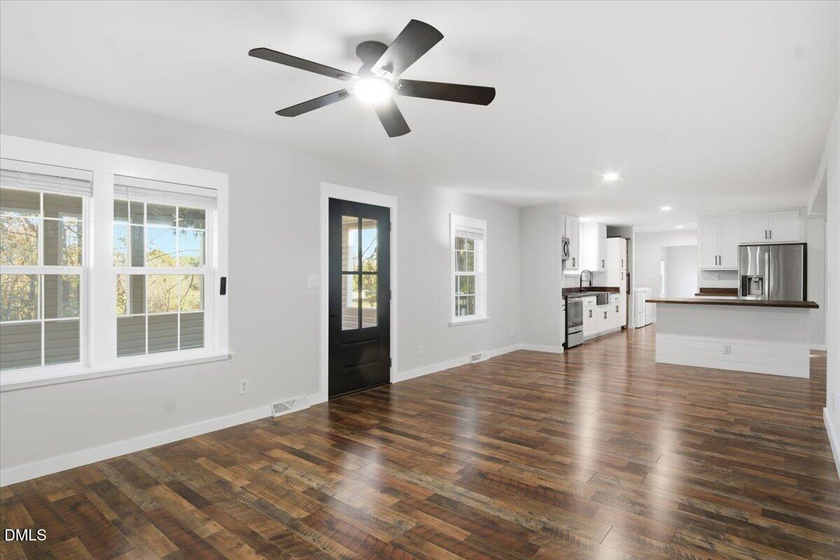 287 Moss Stock Farm Road Kittrell, NC 27544 - Photo 13 of 54 a view of an empty room with kitchen and window