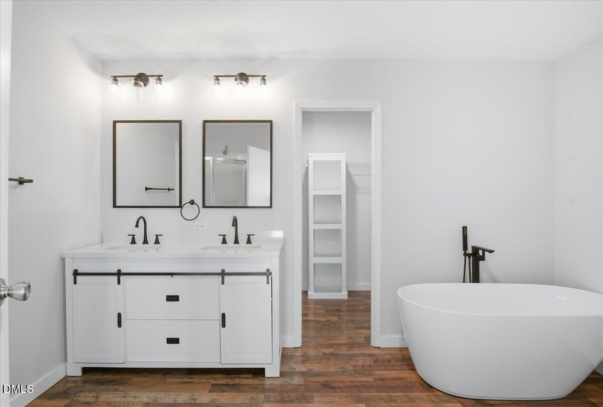 287 Moss Stock Farm Road Kittrell, NC 27544 - Photo 20 of 54 a bathroom with a sink and a mirror