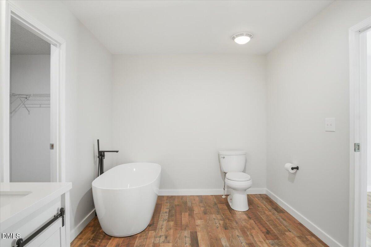 287 Moss Stock Farm Road Kittrell, NC 27544 - Photo 21 of 54 a bathroom with a toilet and a sink