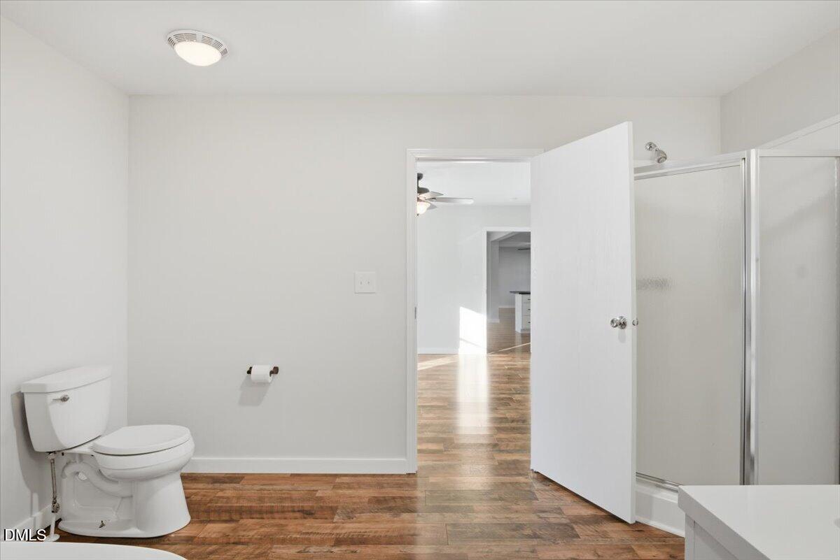 287 Moss Stock Farm Road Kittrell, NC 27544 - Photo 22 of 54 a bathroom with a toilet and a shower