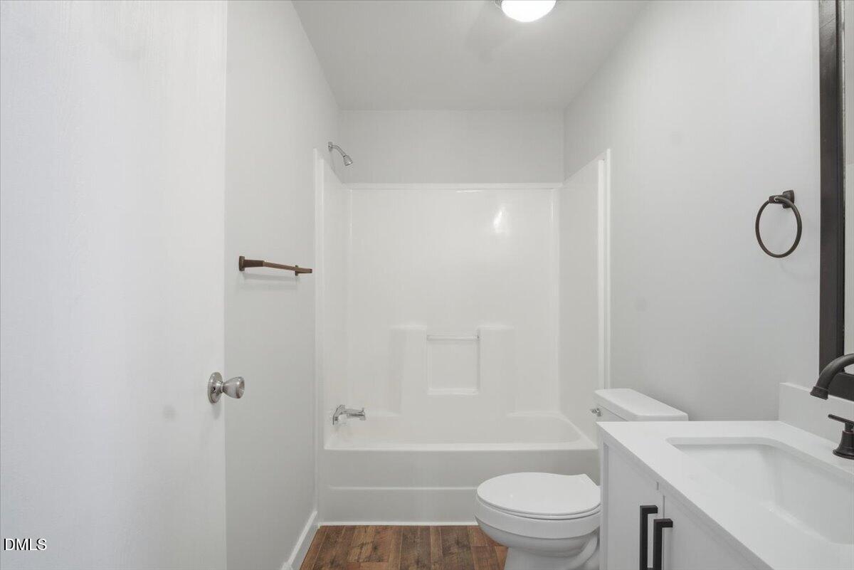 287 Moss Stock Farm Road Kittrell, NC 27544 - Photo 24 of 54 a bathroom with a sink a toilet and shower