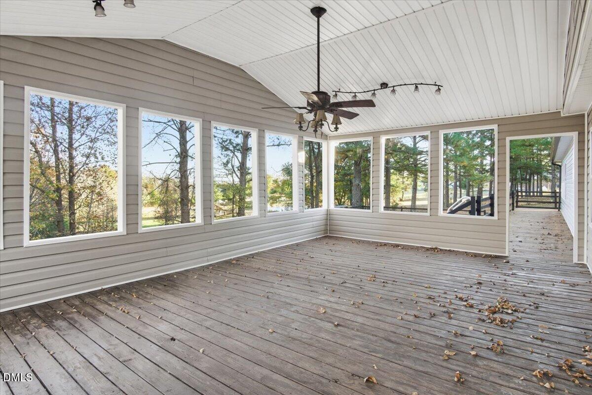 287 Moss Stock Farm Road Kittrell, NC 27544 - Photo 33 of 54 a view of an empty room with a window and wooden floor