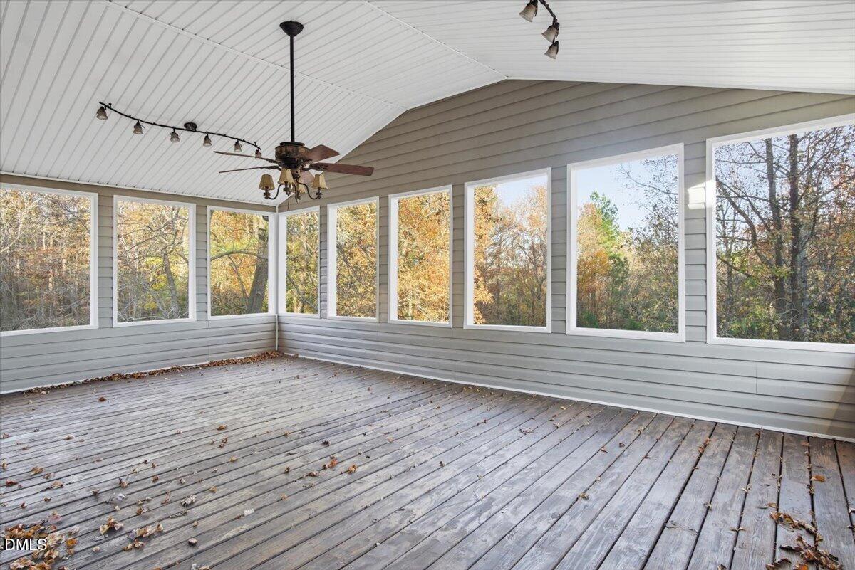 287 Moss Stock Farm Road Kittrell, NC 27544 - Photo 34 of 54 a view of an empty room with wooden floor and a window