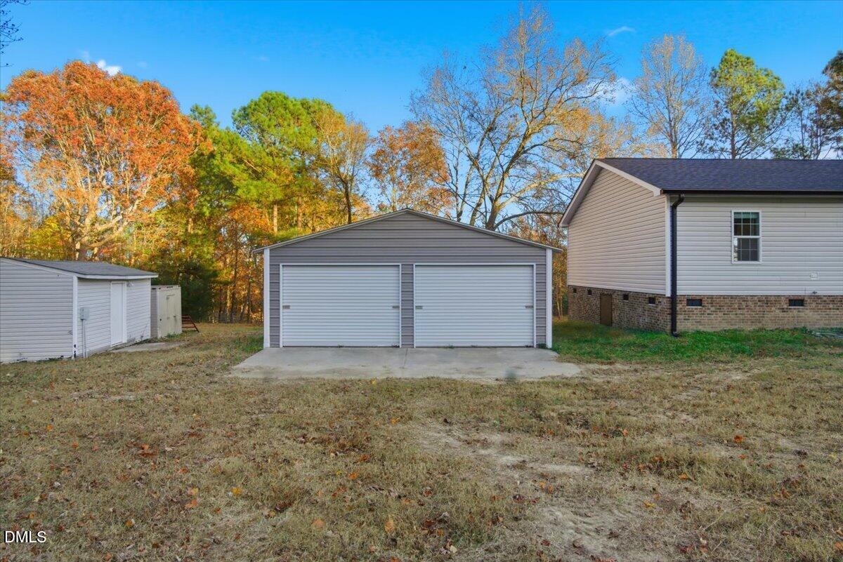 287 Moss Stock Farm Road Kittrell, NC 27544 - Photo 40 of 54 a view of a house with a yard and large tree